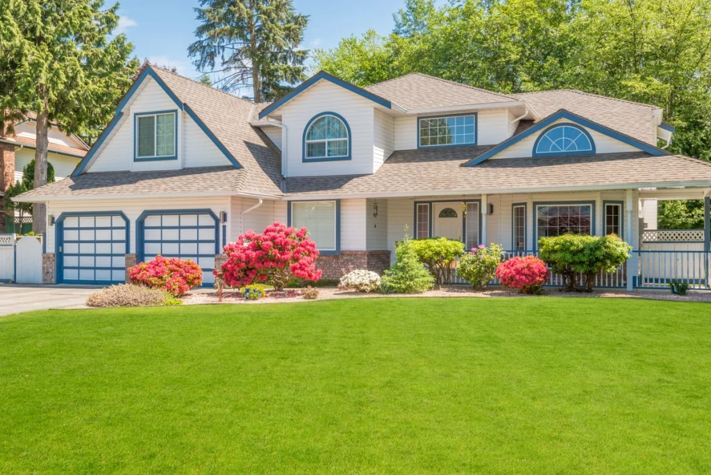 large house with new roofing shingles and dormer