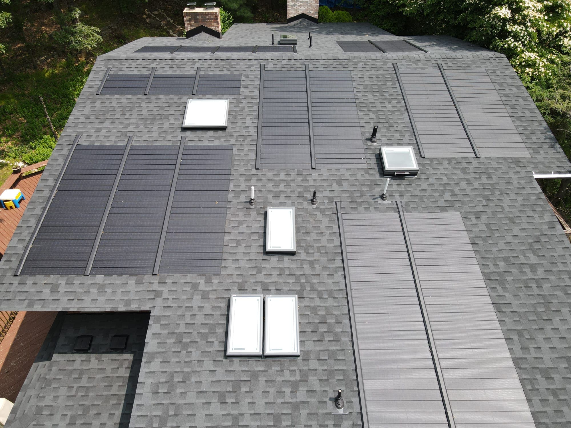 solar shingles installed on asphalt shingle roof