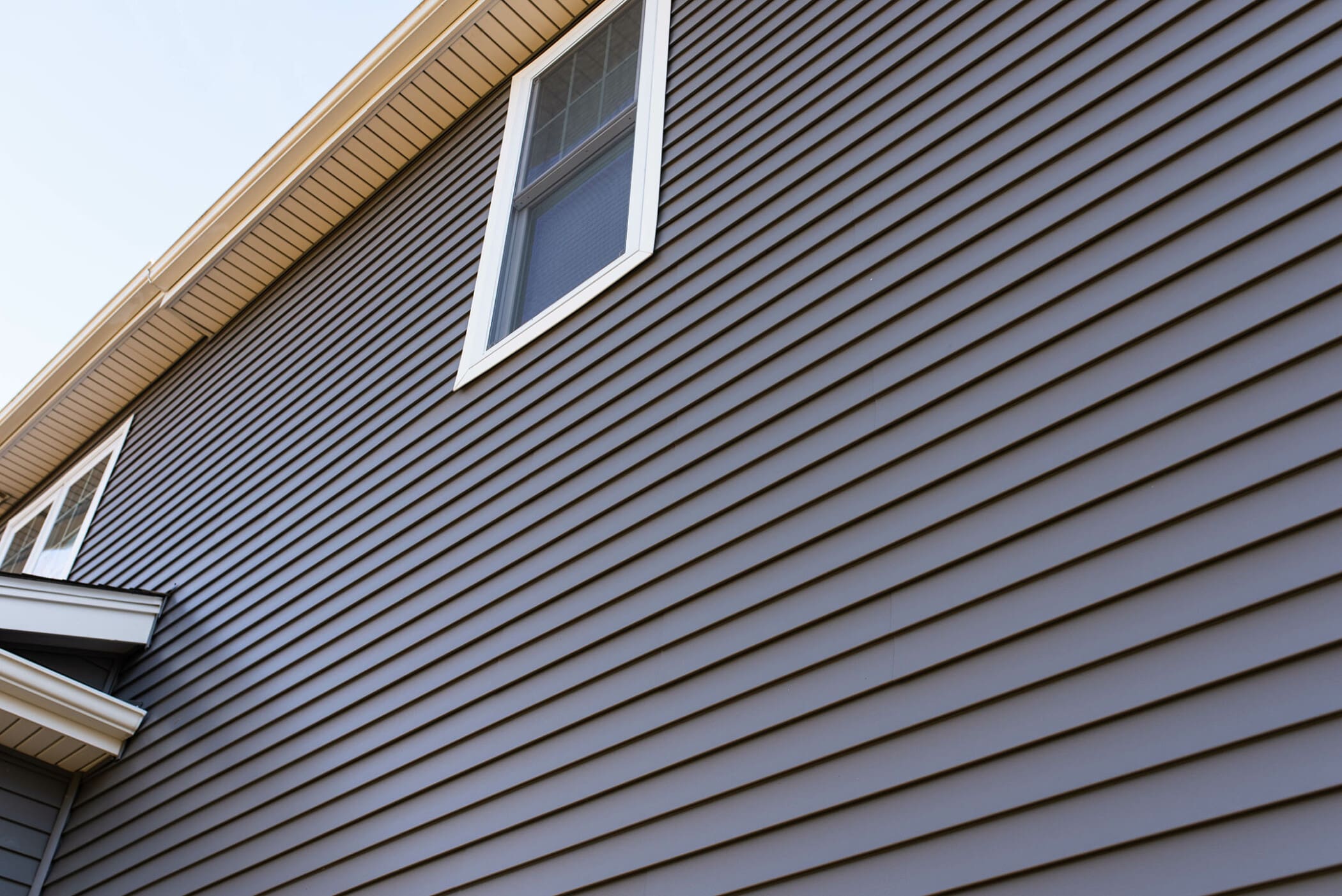 close up of blue vinyl siding