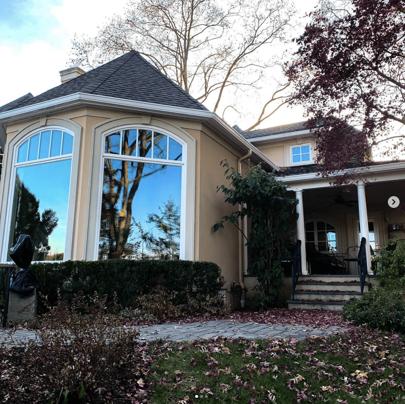 window and door services on beige home by blue nail exteriors